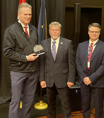 Alaska Gov. and IOGCC Chair Mike Dunleavy (left) and IOGCC Eric Vendel (right) present RRC Chairman Jim Wright with the Chair’s Stewardship Award for Environmental Partnership on behalf of the agency during the IOGCC Annual Conference in Anchorage, Alaska, on Sept. 25, 2025.